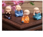 AMGHUB Monk Figurines – 4-Piece Decorative Resin Set for Home & Office Décor | Peaceful Buddha Monk Statues for Shelf, Desk & Gifting